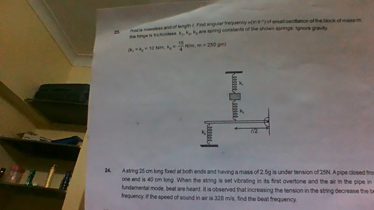 Question image for rod is massless and of length l. find angular fre